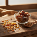 Myrrh resin (Murr/Bol) on wooden surface with glass bowl and wooden spoon