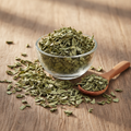 Babool Leaves (Pattay Babool/Acacia Arabica) dried leaves on wooden surface with glass bowl and wooden spoon